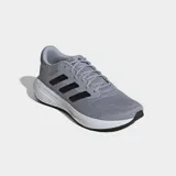 Championes de running Adidas modelo Response Runner en color gris con las icónicas tres tiras en negro. Poseen un exterior de malla transpirable, mediasuela de EVA para una amortiguación cómoda y suela de caucho resistente.
