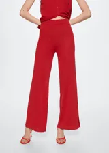 Pantalon de punto fino mezcla de lino, color rojo, con diseño recto de tiro alto, cintura elástica y aberturas laterales en el bajo.