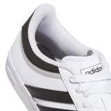 Championes Adidas Hoops 4.0 de diseño urbano inspirado en el básquetbol. Presentan un empeine de cuero sintético blanco con las icónicas tres tiras laterales en color negro y detalles en gris en el talón. Cuentan con cierre de cordones y suela de goma tipo cupsole para mayor estabilidad.