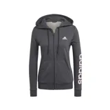 Campera Adidas Essentials de mujer color gris con cierre frontal y capucha con cordón ajustable. Logo de Adidas estampado en el pecho y letras verticales en la manga izquierda.
