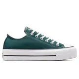 Championes Converse Chuck Taylor All Star de lona color verde oscuro, con plataforma blanca y suela de goma. Cierre de cordones blancos y puntera de goma blanca.
