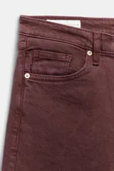 Jeans de tiro alto con cinco bolsillos, diseño cropped flare y bajo sin costuras. Cuenta con cierre frontal de cremallera y botón metálico.