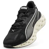 Championes Puma Softride Frequence, color negro con detalles en color arena. Presentan una suela con diseño alveolar distintivo y el logo de la marca en el lateral y la lengüeta.