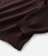 Suéter de punto en jacquard color bordó con diseño de cuello polo y cierre frontal parcial. Presenta estampado frontal con la palabra 'EASY' y la frase 'plans being' en color celeste, además de un pequeño logo bordado. Posee mangas largas con puños acanalados y un corte holgado.
