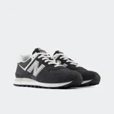 Championes urbanos New Balance modelo 574, color negro con detalles en gris y blanco, confeccionados en gamuza y malla, con logo "N" característico en los laterales y entresuela ENCAP.