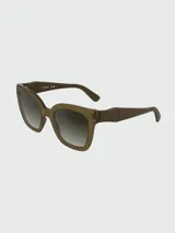 Lentes de sol Longchamp con armazón de acetato en tono marrón translúcido y cristales degradados.