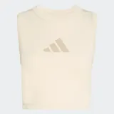 Musculosa deportiva Adidas línea Z.N.E. de corte ajustado, color beige claro, con cuello redondo y logo de la marca estampado en el pecho en tono a juego.