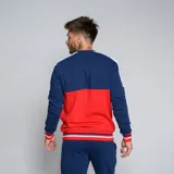Buzo de cuello redondo Umbro del Club Nacional de Football. Diseño tricolor con cuerpo superior blanco, franja central azul y detalles en rojo en hombros y puños. Incluye logo de Umbro y escudo del club en el pecho.