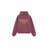 Hoodie oversized color borravino con capucha y bolsillo canguro, con estampado frontal en tono dorado con texto y logotipo de la marca.