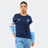 Buzo de cuello redondo Umbro del Club Nacional de Football, con diseño de bloques de color en azul marino, blanco y celeste. Presenta el logo de la marca y el escudo del club bordados en el pecho.
