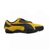 Championes Puma modelo Mostro OG Prime, color amarillo con detalles en negro. Presentan un diseño distintivo con suela de goma con relieve de tachones, cierre de velcro y la icónica franja lateral de la marca.