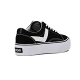 Championes de lona y gamuza color negro con plataforma blanca. Presentan cordones blancos, costuras en contraste y el icónico logo de la marca en el lateral.