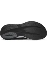 Championes de running Under Armour Velociti Distance, color negro con entresuela blanca y negra, y detalles en plateado y rojo. Cuentan con capellada de malla transpirable y tecnología de amortiguación UA HOVR+.