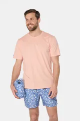 Short de baño estampado de microfibra con diseño de hojas y flores en tonos celeste y azul. Incluye una bolsita a juego para transportarlo.