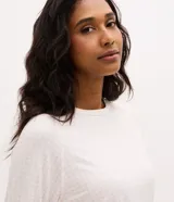 Blusa de pijama de mujer Lov, confeccionada en poliéster y elastano, con estampa de cuadros vichy en tonos rosados y blancos, cuello redondo y mangas largas.