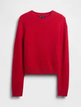 Sweater de punto color rojo, con cuello redondo, mangas largas y puños acanalados. Presenta un diseño clásico y minimalista con ajuste estándar.