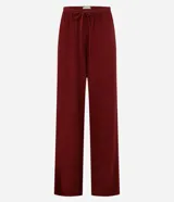 Pantalón de viscosa y lino color borgoña, de corte recto y cintura elástica con cordón ajustable.
