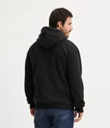 Buzo cerrado de fleece con capucha ajustable, manga larga con puños acanalados, bolsillo tipo canguro y cintura ajustada.