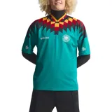 Camiseta de fútbol Adidas retro de la selección de Alemania, diseño alternativo de 1994. Color principal verde turquesa con cuello en V amarillo, rojo y negro, y un llamativo estampado geométrico en el pecho y las mangas en tonos negro, rojo y amarillo.