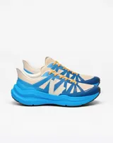 Championes de running Veja modelo Condor 3 ADV, con diseño técnico en combinación de colores azul y beige. Presentan una entresuela voluminosa de color azul vibrante, cordones en tono ocre y el logo de la marca en el lateral.