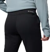 Pantalón de trekking Columbia para hombre, confeccionado en forro polar de rejilla con tecnología Omni-Wick que absorbe la humedad. Presenta un corte ajustado, cintura interior ajustable, bolsillos laterales, bolsillo posterior con cremallera y dobladillos elásticos.