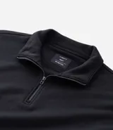 Buzo de corte holgado tipo ballon, color marrón oscuro, con cuello alto y cierre frontal parcial. Presenta mangas largas con puños elásticos y cordón ajustable en el ruedo.