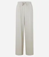 Pantalón fluido de Blue Steel confeccionado en mezcla de viscosa y lino, color beige, con cintura elástica fruncida y lazo ajustable del mismo tejido. Presenta un corte holgado de pernera ancha.