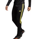 Pantalón de fútbol Adidas Tiro 23 Club para hombre, color negro con logo y rayas laterales en amarillo flúor. Confeccionado en tejido transpirable AEROREADY, de corte ajustado y con cierres en los puños.
