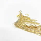 Caravana dorada con forma de trepadora, con strass y cierre con clip.