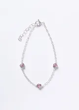 Pulsera de cadena tipo forcé de plata 925 con tres dijes de corazones engastados con zirconias rosas.