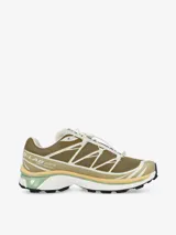 Championes de trail running Salomon modelo XT-6, con diseño técnico en tonos marrones y arena. Presentan sistema de cordones de ajuste rápido, estructura reforzada con tecnología Sensifit y suela con tacos para terreno blando.