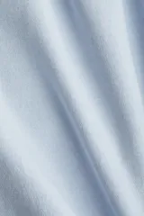 Pantalón de jogging de corte holgado en tejido de felpa con interior cepillado suave. Modelo de tiro alto con cintura elástica fruncida y piernas anchas.