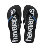 Sandalias tipo ojotas Havaianas modelo Top Logomania, con base negra y suela lateral azul. Presentan el logo de la marca estampado en gran tamaño sobre la plantilla y en relieve sobre las tiras negras.