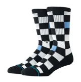 Medias de caña media Stance con diseño de tablero de ajedrez en color negro y blanco, con detalles en azul claro. Presentan el logo de la marca bordado en el lateral.