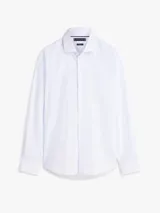 Camisa de manga larga Tommy Hilfiger color celeste con micro estampado de minipaisley, cuello clásico y cierre frontal de botones.