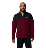 Campera polar Columbia con cierre frontal completo y cuello alto. Presenta un diseño de bloques de color con la parte superior en negro y la inferior en bordó, incluyendo bolsillos laterales con cierre y logo de la marca en el pecho.
