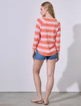 Buzo Ninety de algodón a rayas horizontales color naranja y blanco, de manga larga y cuello redondo. Tejido fino.