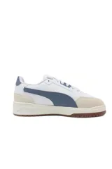 Championes Puma Shuffle Downtown, color blanco con detalles en negro y dorado.