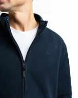 Campera de polar con cuello alto, cierre frontal completo y bolsillos laterales con cierre.