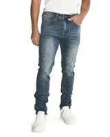 Jeans skinny para hombre, de corte ajustado y diseño de cinco bolsillos, con cierre de cremallera y botón metálico. Presenta un lavado azul medio con efecto desgastado.