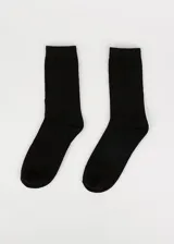 Par de medias de media caña color negro.