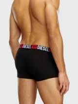 Boxer de algodón negro con cintura elástica ancha que presenta el logo de la marca Diesel en letras blancas y rojas.