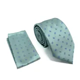 Conjunto de corbata y pañuelo de bolsillo color verde agua con estampado de pequeñas gotas en azul y blanco.