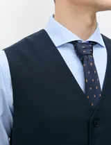 Chaleco formal sastrero Harrington Select de color azul marino, con cuello en V, cierre frontal de botones y bolsillos ribeteados.