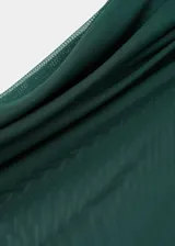 Top de manga corta color verde oscuro, confeccionado en tejido semitransparente con fruncidos laterales, cuello asimétrico y diseño entallado con forro interior.