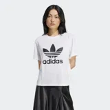Remera blanca de corte holgado con logo de Adidas trifolio estampado en el frente.