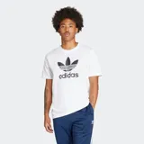 Remera blanca de algodón con cuello redondo y logo Adidas Trifolio estampado en el pecho.
