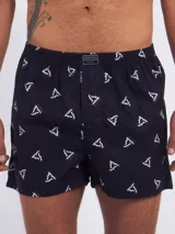 Bóxer de algodón blanco con estampado de flores pequeñas color celeste, con cintura elástica y logo de la marca en el centro.