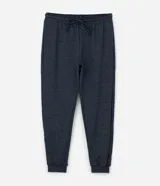 Pantalón de pijama tipo jogger color azul marino, con cintura elástica y cordón de ajuste. Presenta puños elásticos en los tobillos y un acabado jaspeado.