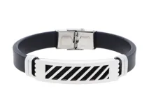 Pulsera de goma negra con placa central de acero inoxidable con diseño de líneas diagonales caladas. Cierre de acero inoxidable.